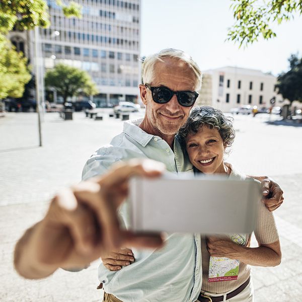 Couple listening together with a hearing aid